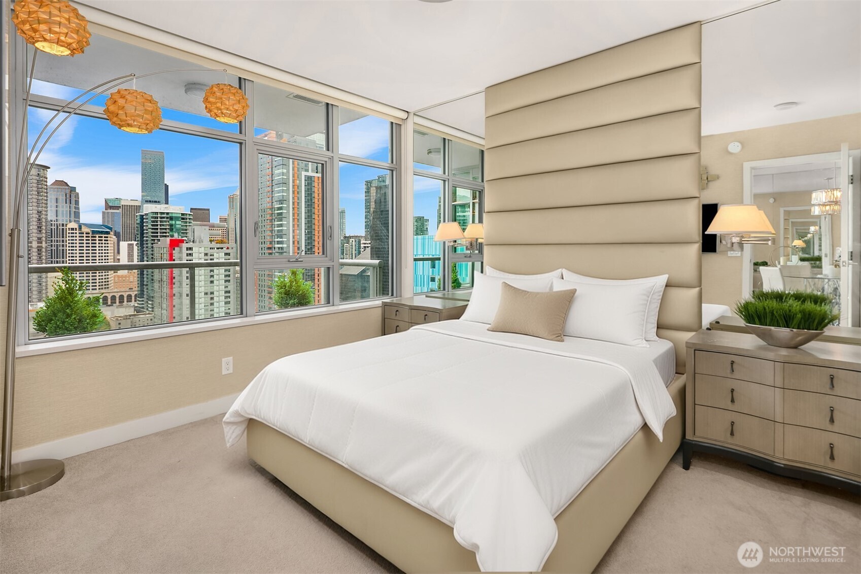 588 Bell Street, Unit 2405S Seattle, WA 98121 - Photo 9 of 34 a bedroom with a bed painting on wall and a large window