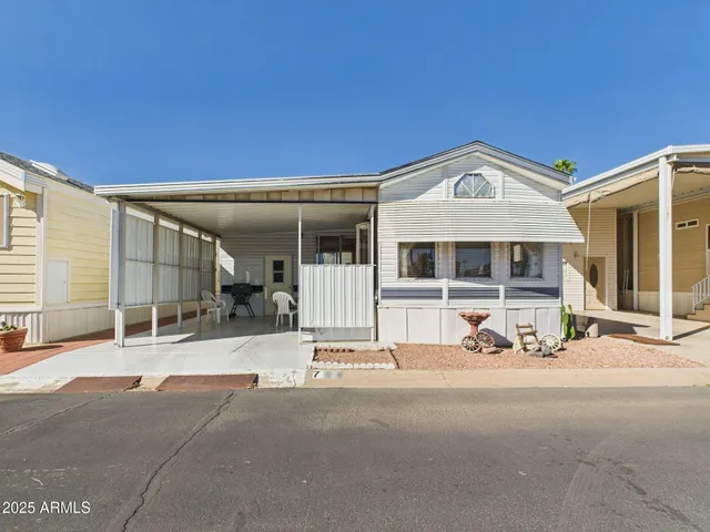 a front view of a house with a outdoor space