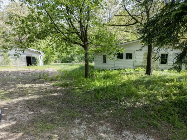a front view of a house with yard