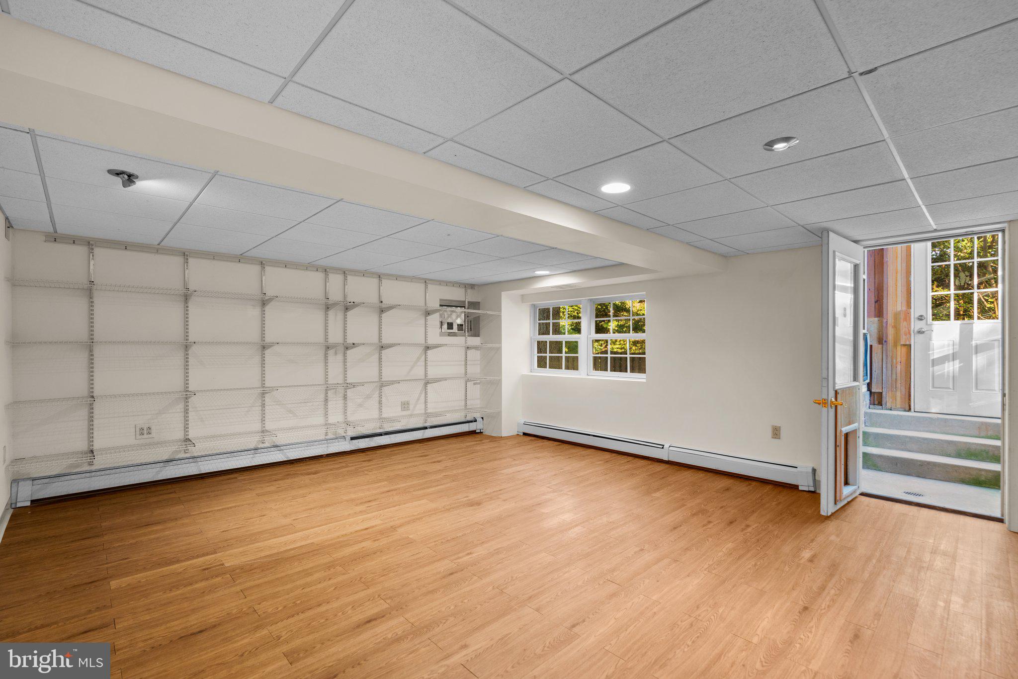 7908 Brooklyn Bridge Road Laurel, MD 20707 - Photo 33 of 55 BASEMENT FINISHED AREA STORAGE SHELVES & WALKOUT