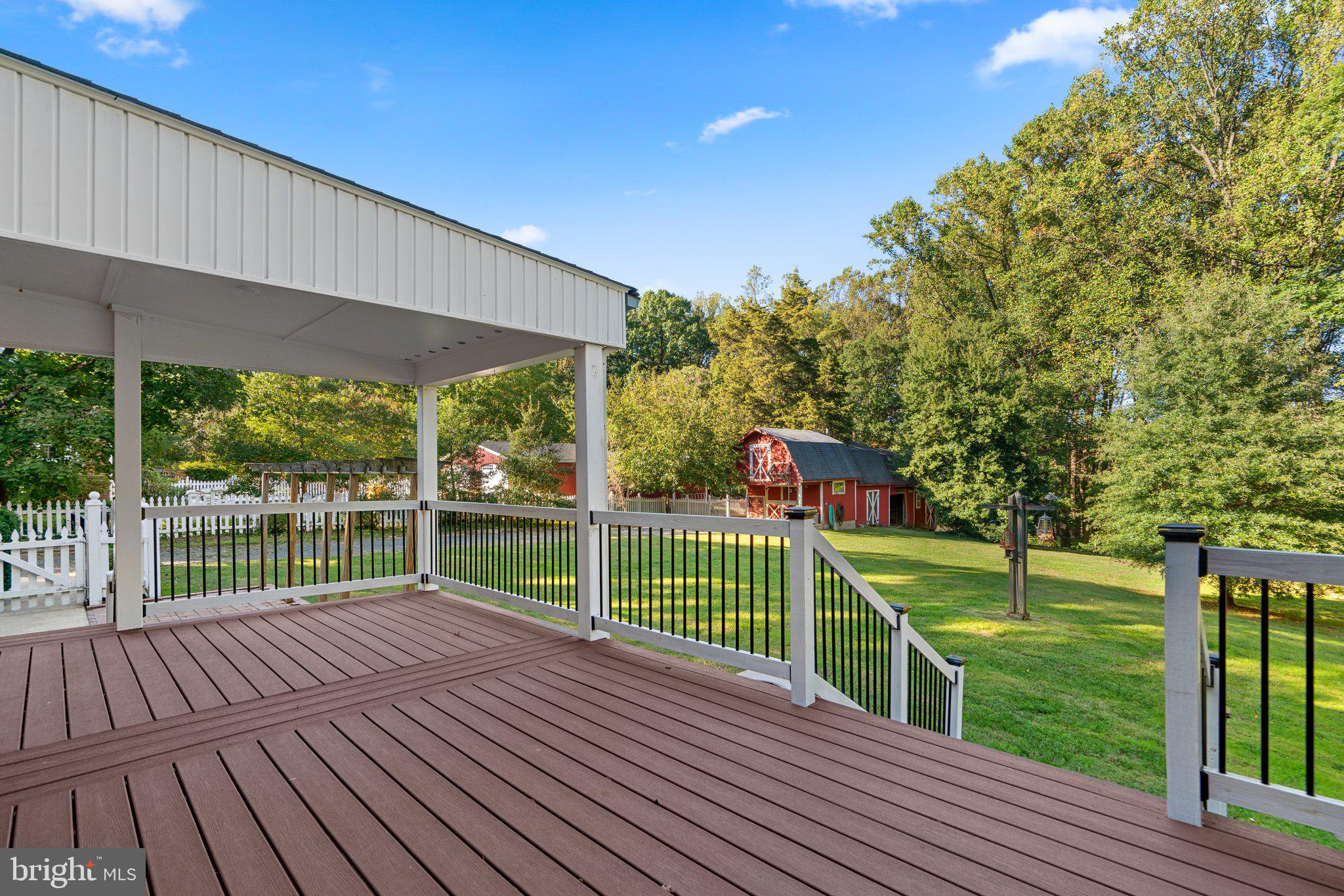 7908 Brooklyn Bridge Road Laurel, MD 20707 - Photo 41 of 55 SPACIOUS DECK WITH COVERED AREA - WIDE STAIRWAY