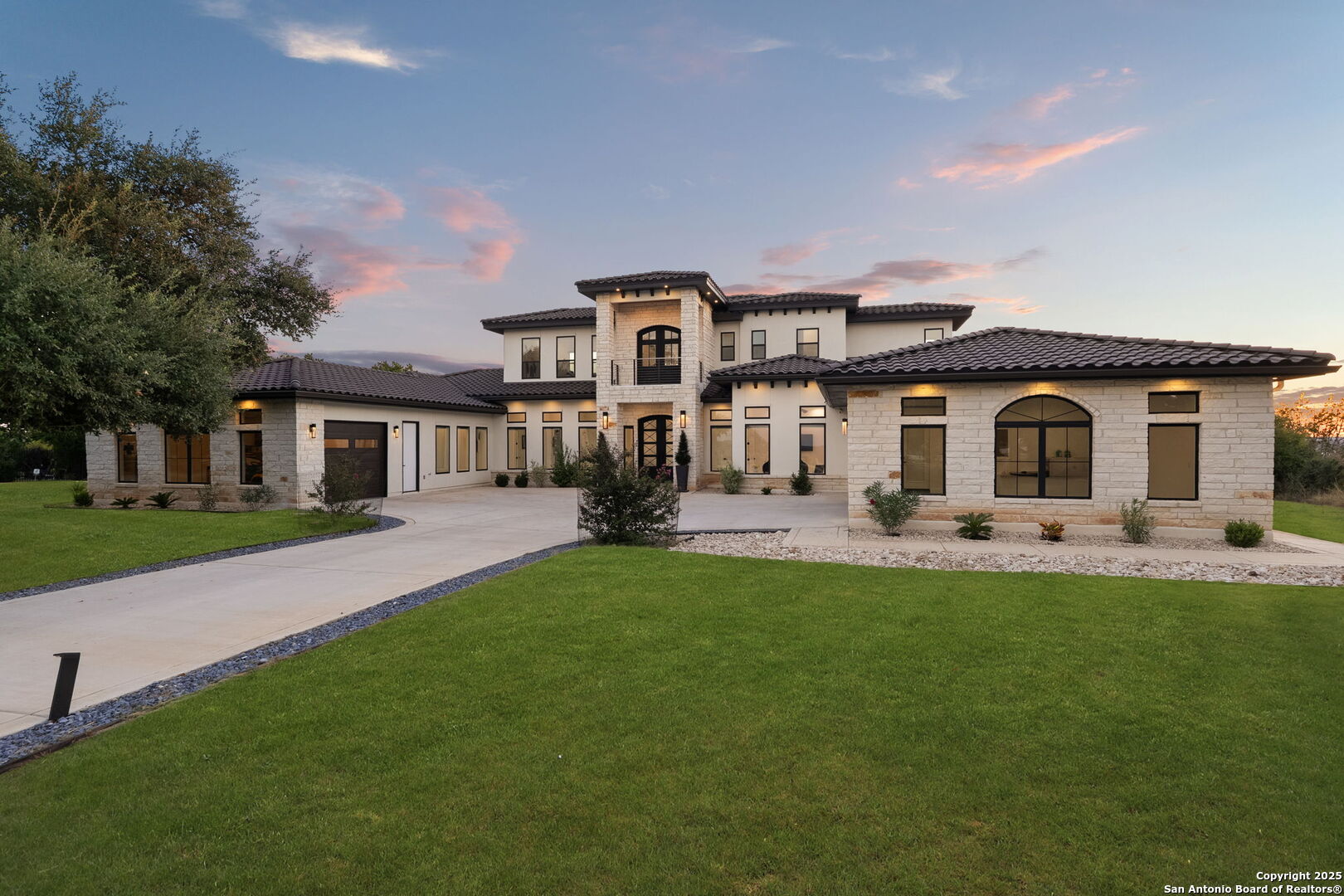 a front view of a house with a garden and porch