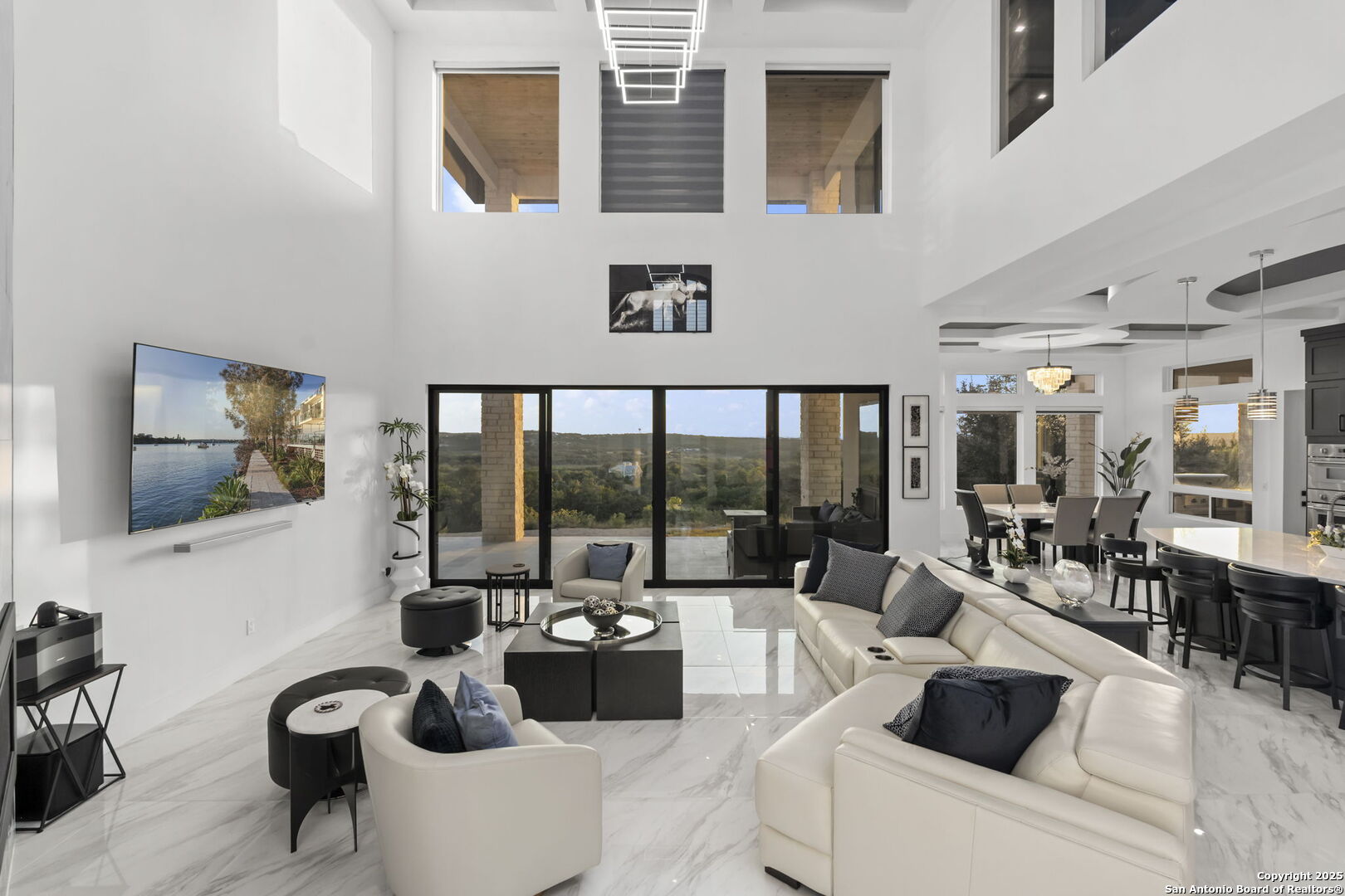 1178 Mystic Parkway Spring Branch, TX 78070 - Photo 14 of 62 a living room with couches a coffee table and a flat tv screen next to a window
