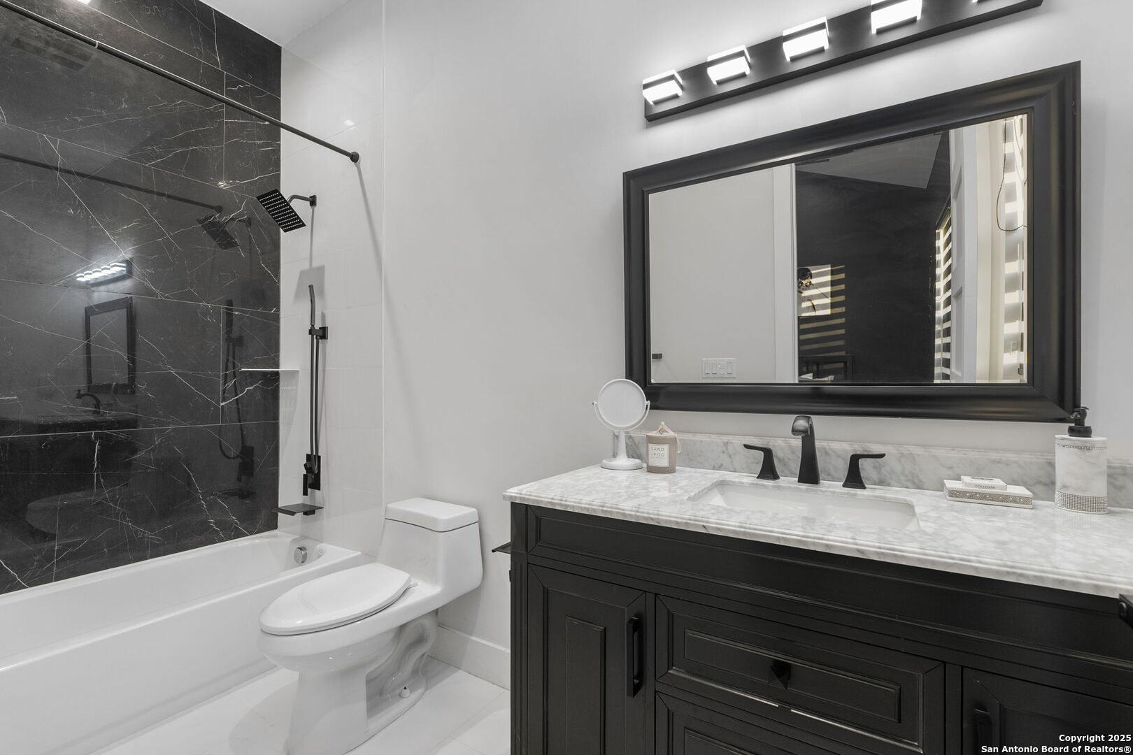 1178 Mystic Parkway Spring Branch, TX 78070 - Photo 26 of 62 a bathroom with a toilet a sink a mirror and shower