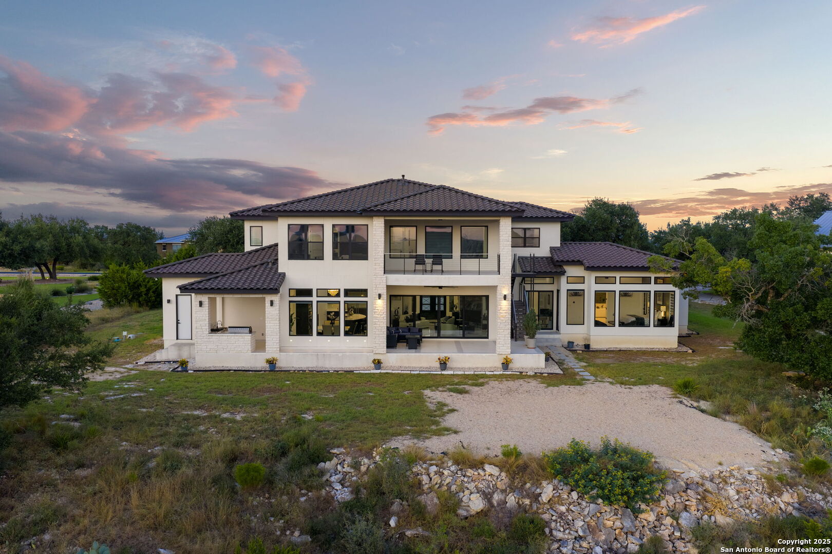 1178 Mystic Parkway Spring Branch, TX 78070 - Photo 46 of 62 a front view of a house with garden and trees