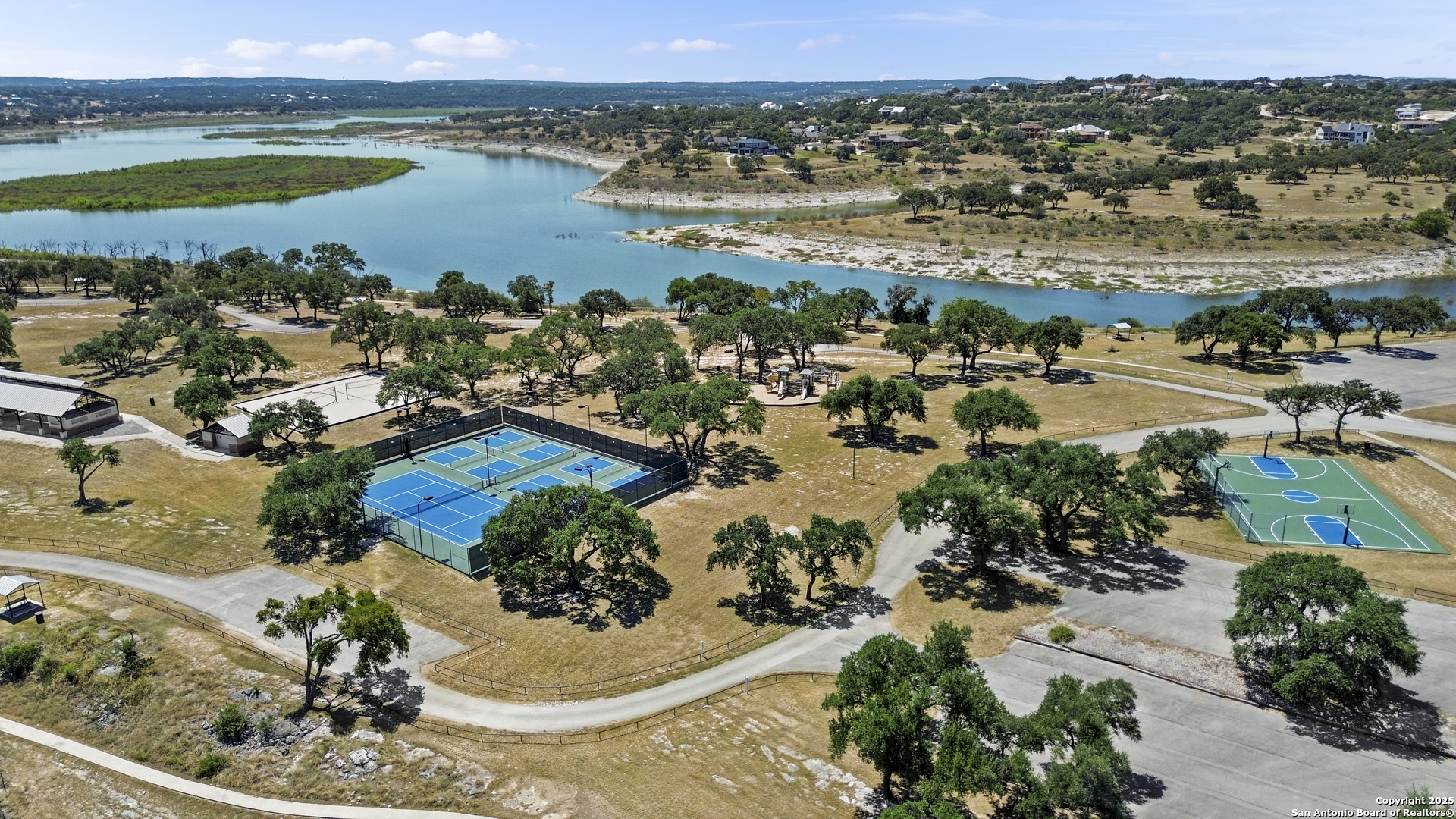 1178 Mystic Parkway Spring Branch, TX 78070 - Photo 50 of 62 an aerial view of a house with a lake view