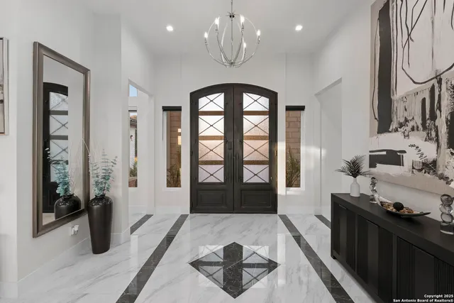 a kitchen with stainless steel appliances a stove a sink and cabinets