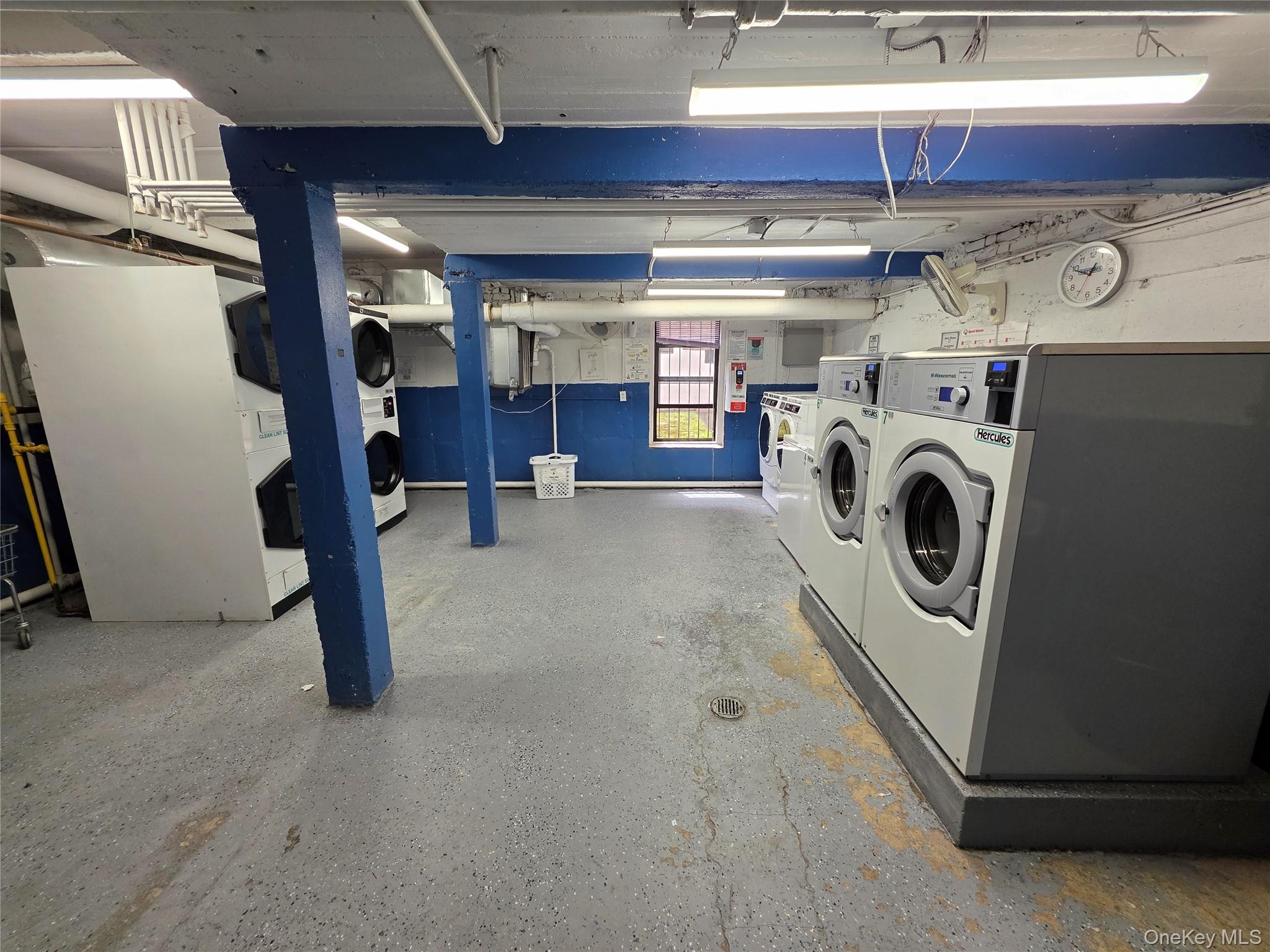 98-50 67th Avenue, Unit 1H Queens, NY 11374 - Photo 12 of 15 a view of a storage & utility room with washer and dryer