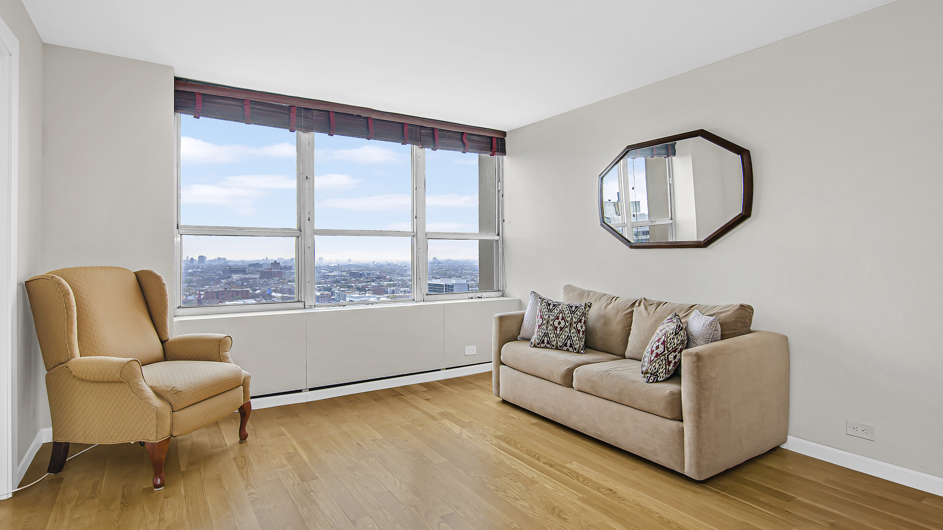 655 West Irving Park Road, Unit 2607 Chicago, IL 60613 - Photo 5 of 16 a living room with furniture and a large window