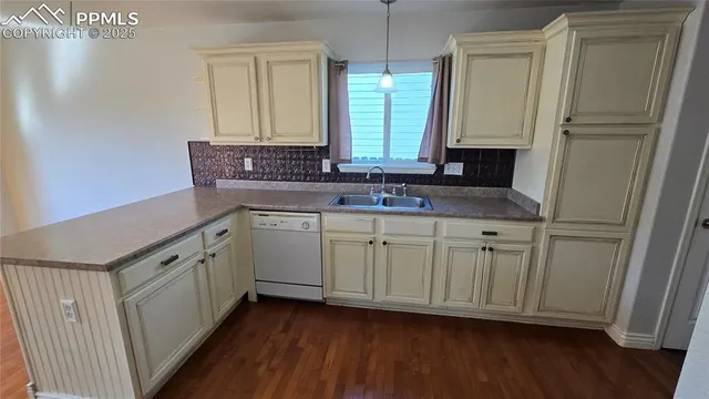 a bedroom with a bed and cabinets