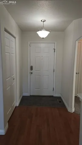 an empty room with closet area