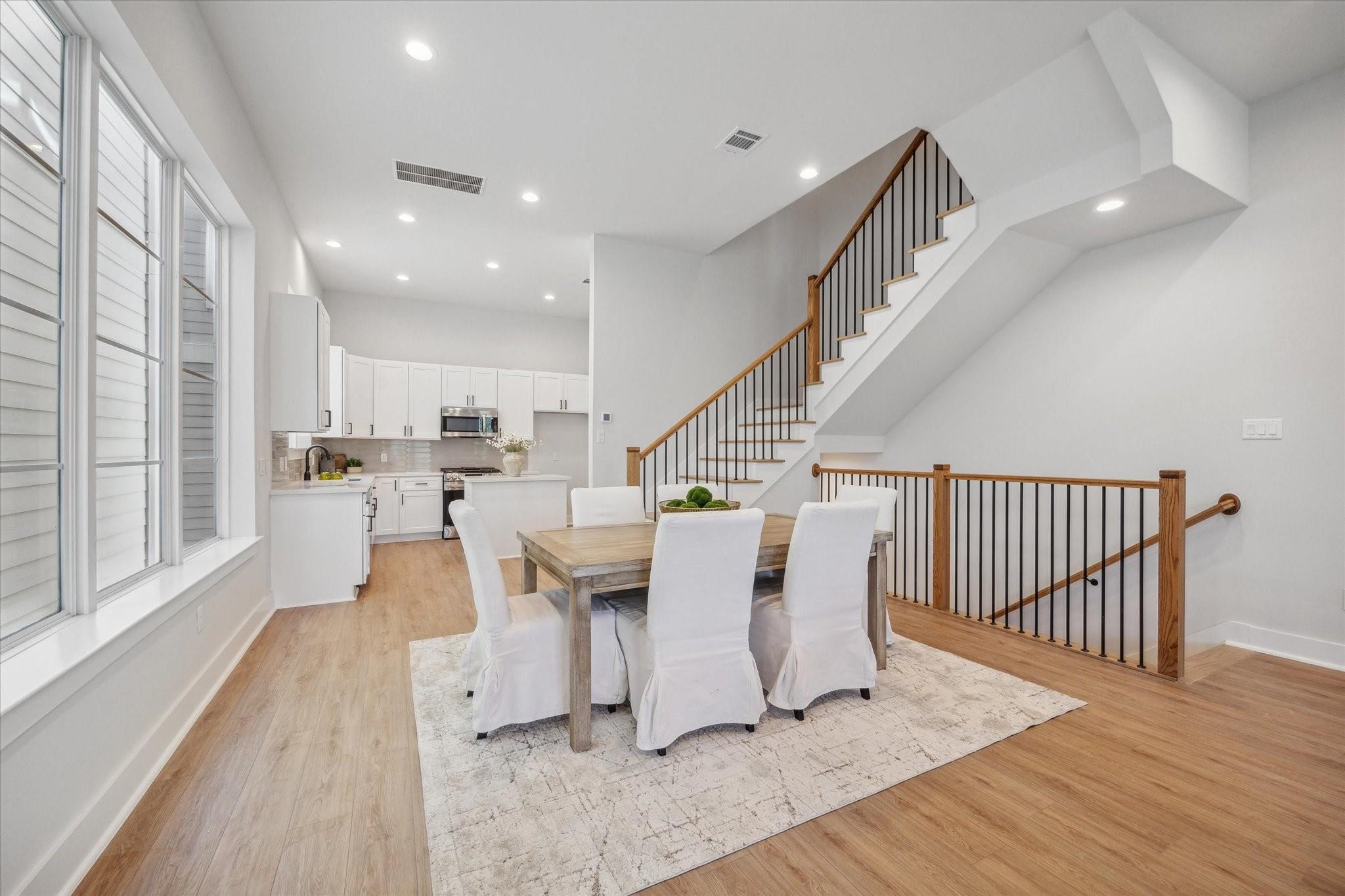 1035 West 17th Street Houston, TX 77008 - Photo 6 of 26 The second floor stands as the heart of this home, drawing you in with its open-concept layout and creating a warm and inviting space.