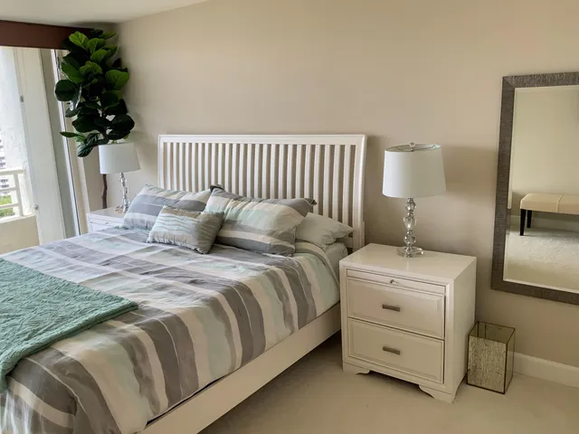 a bathroom with a sink vanity granite tub and shower
