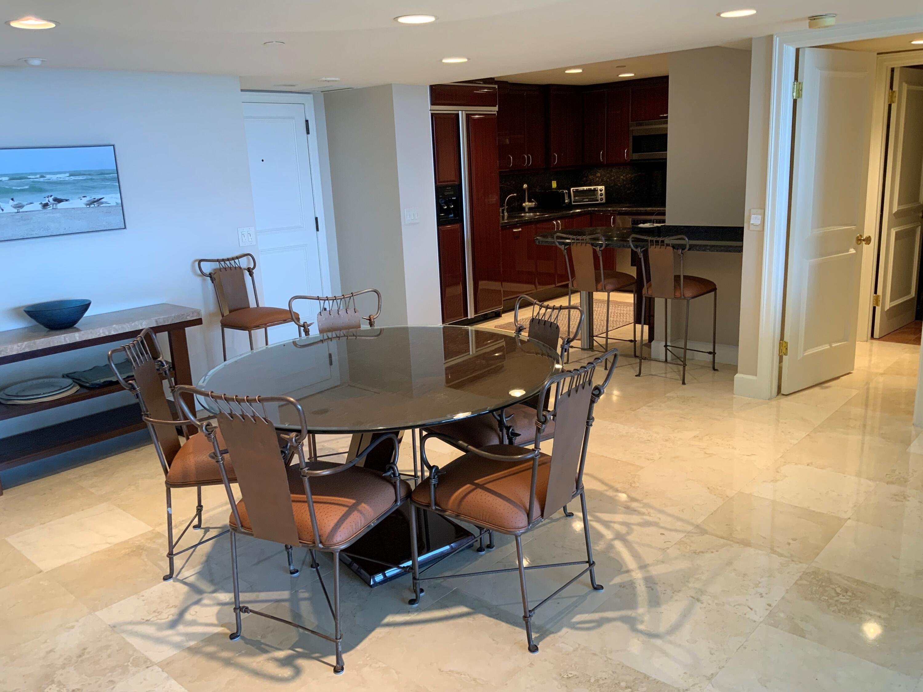 4201 North Ocean Boulevard, Unit 1705 Boca Raton, FL 33431 - Photo 8 of 37 a view of a dining room with furniture