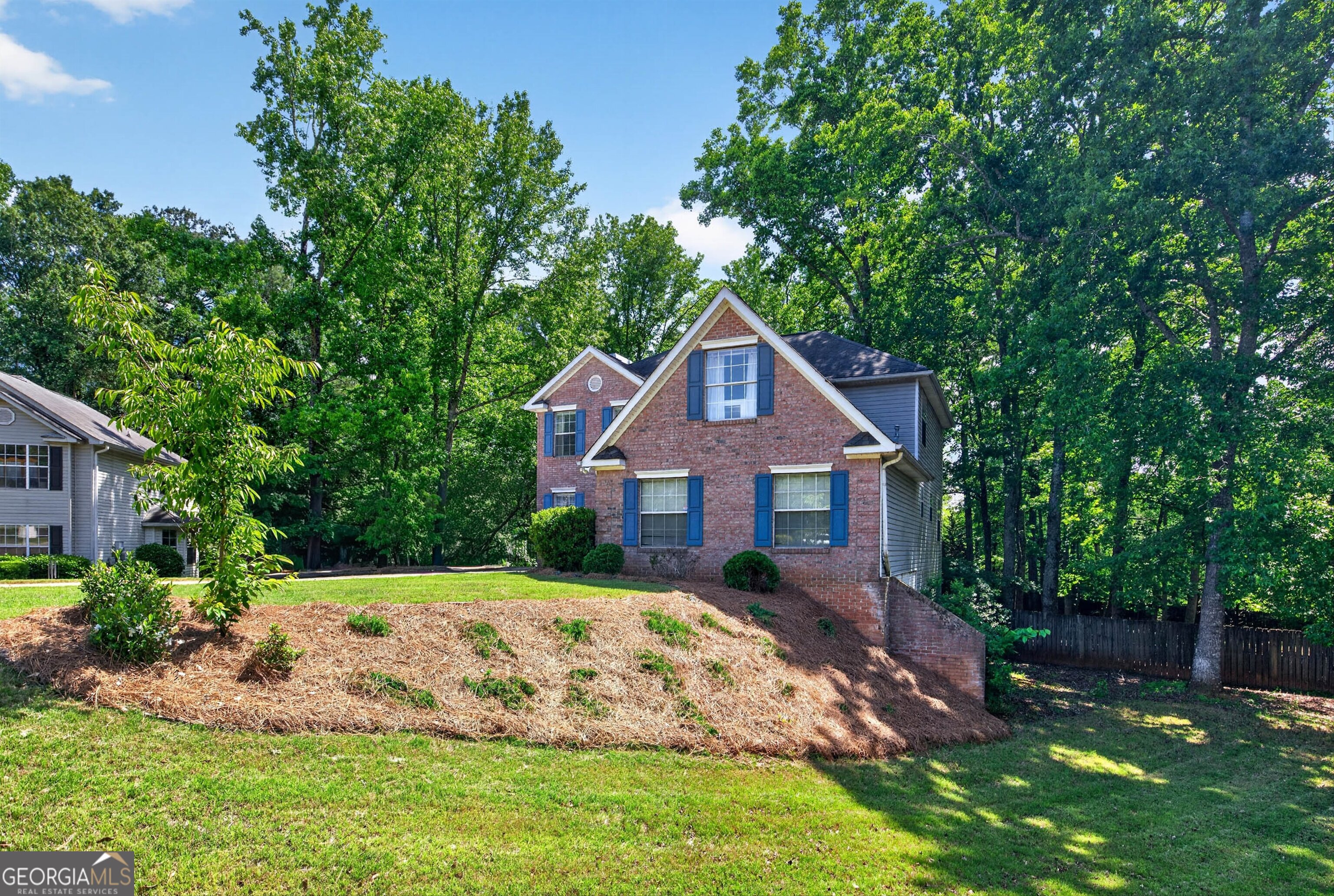 101 Emerald Lane Hampton, GA 30228 - Photo 2 of 72 a front view of a house with a yard