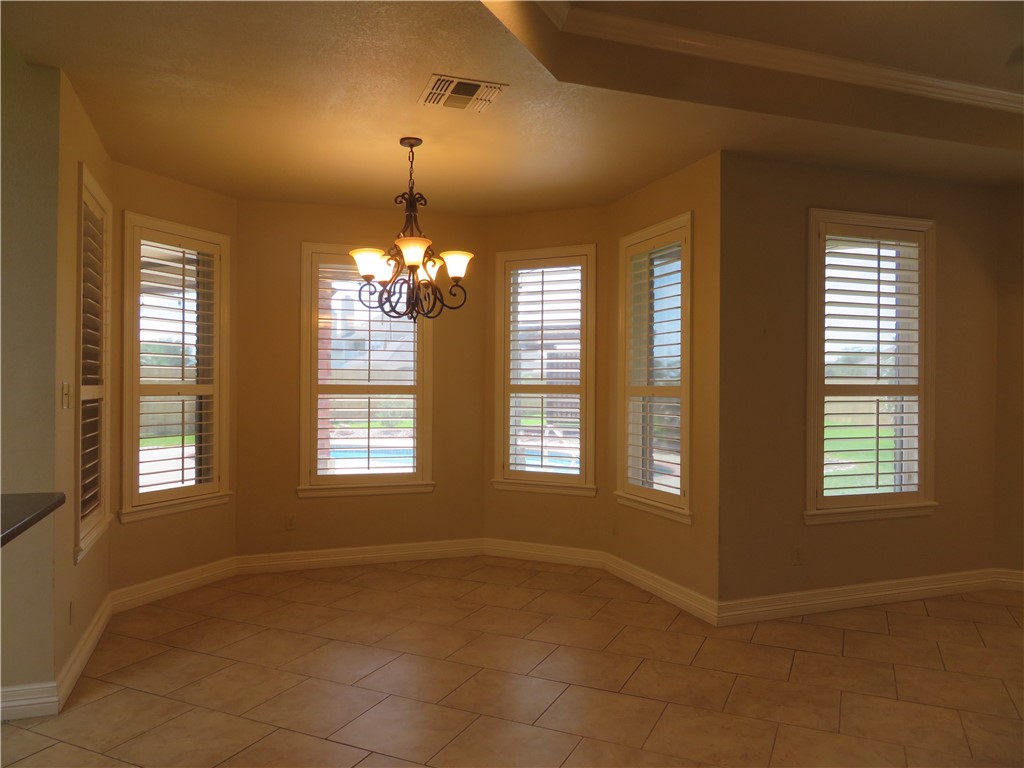 5803 South Oso Parkway Corpus Christi, TX 78414 - Photo 10 of 39 a view of an empty room with a window
