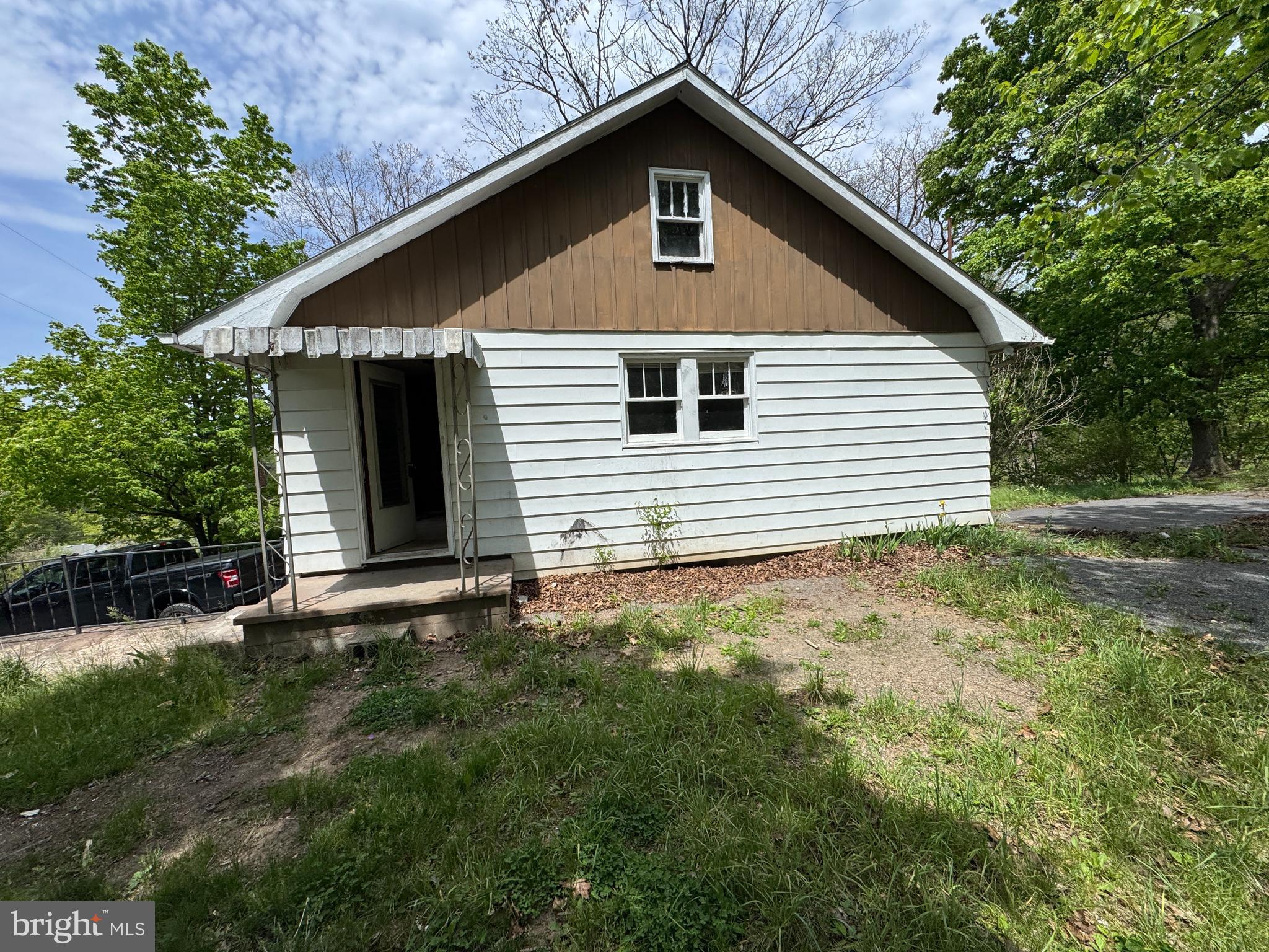 85 Ralph Barnes Lane Fort Ashby, WV 26719 - Photo 1 of 15 a view of a house with a yard