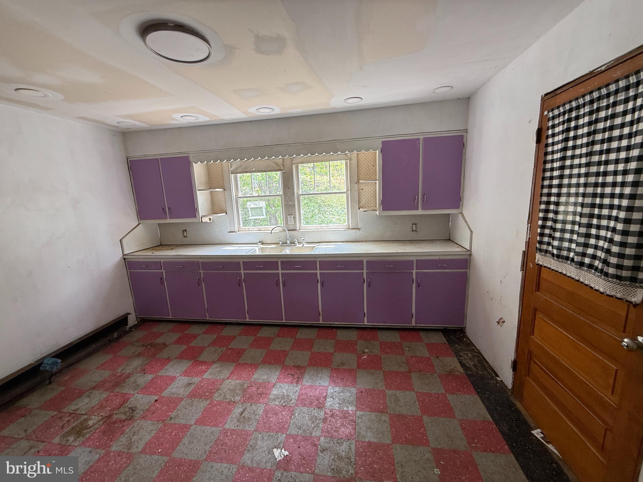 85 Ralph Barnes Lane Fort Ashby, WV 26719 - Photo 5 of 15 a room with a dresser and a window