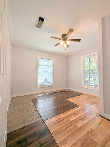 a view of an empty room with a window