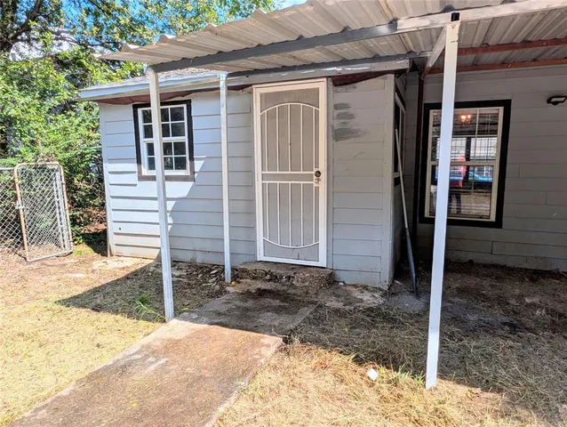 a backyard of a house with seating space
