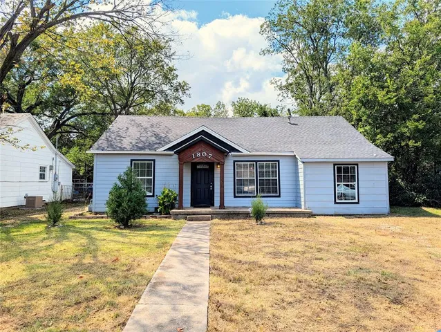 a house with swimming pool in front of it