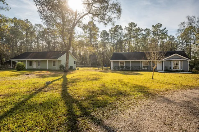 a swimming pool with outdoor seating and yard