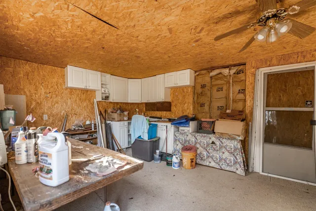 a view of kitchen with furniture and a potted plant