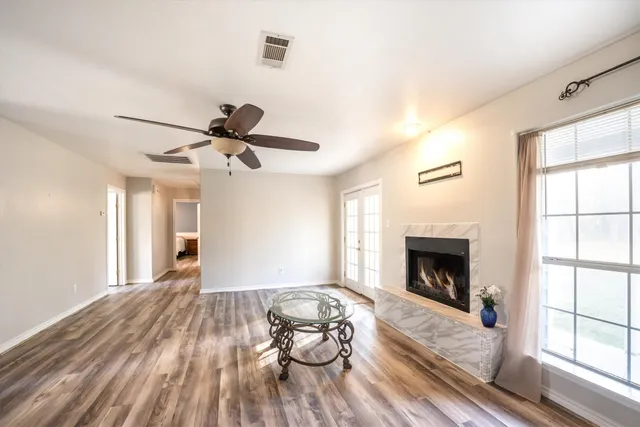 a living room with furniture and a fireplace