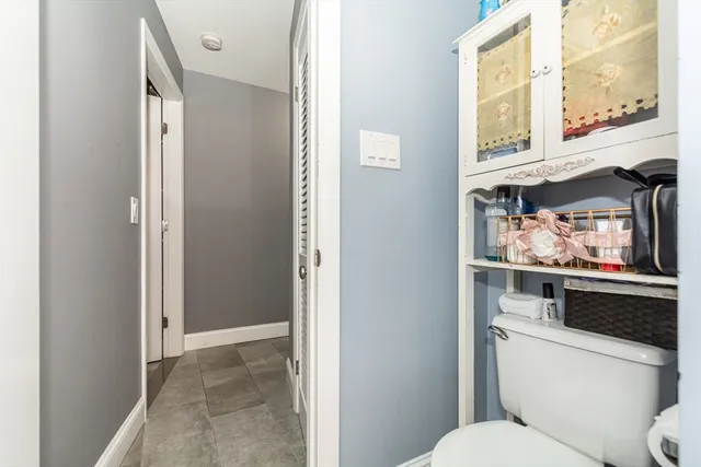 a bathroom with a toilet and a sink