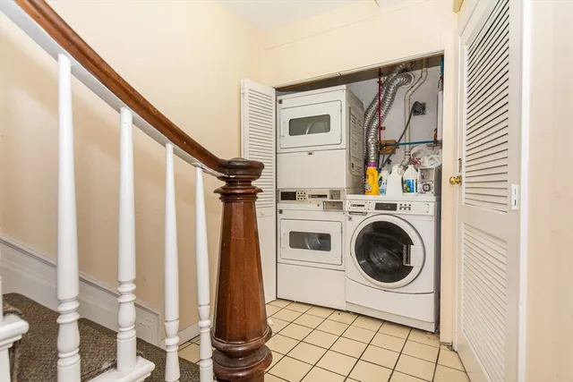 a view of a hallway with washer and dryer