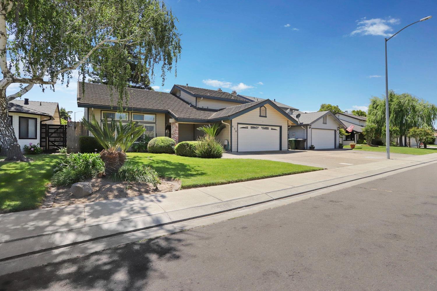 650 Nancy Drive Ripon, CA 95366 - Photo 1 of 1 a house with a outdoor space