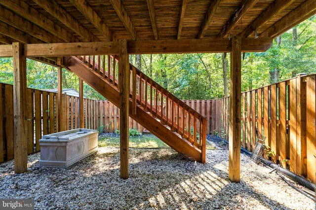 a view of porch with wooden floor