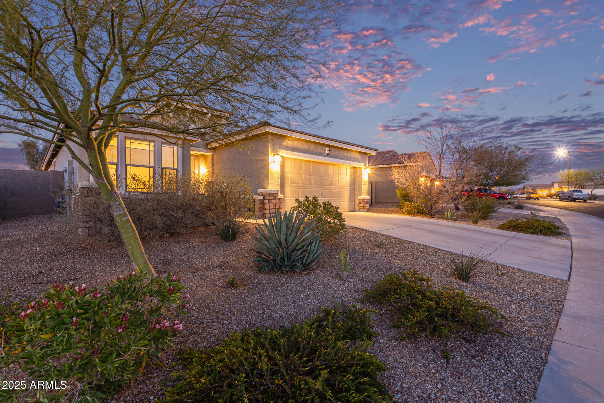 17796 West Sandy Road Goodyear, AZ 85338 - Photo 1 of 68 a view of a pathway with a yard