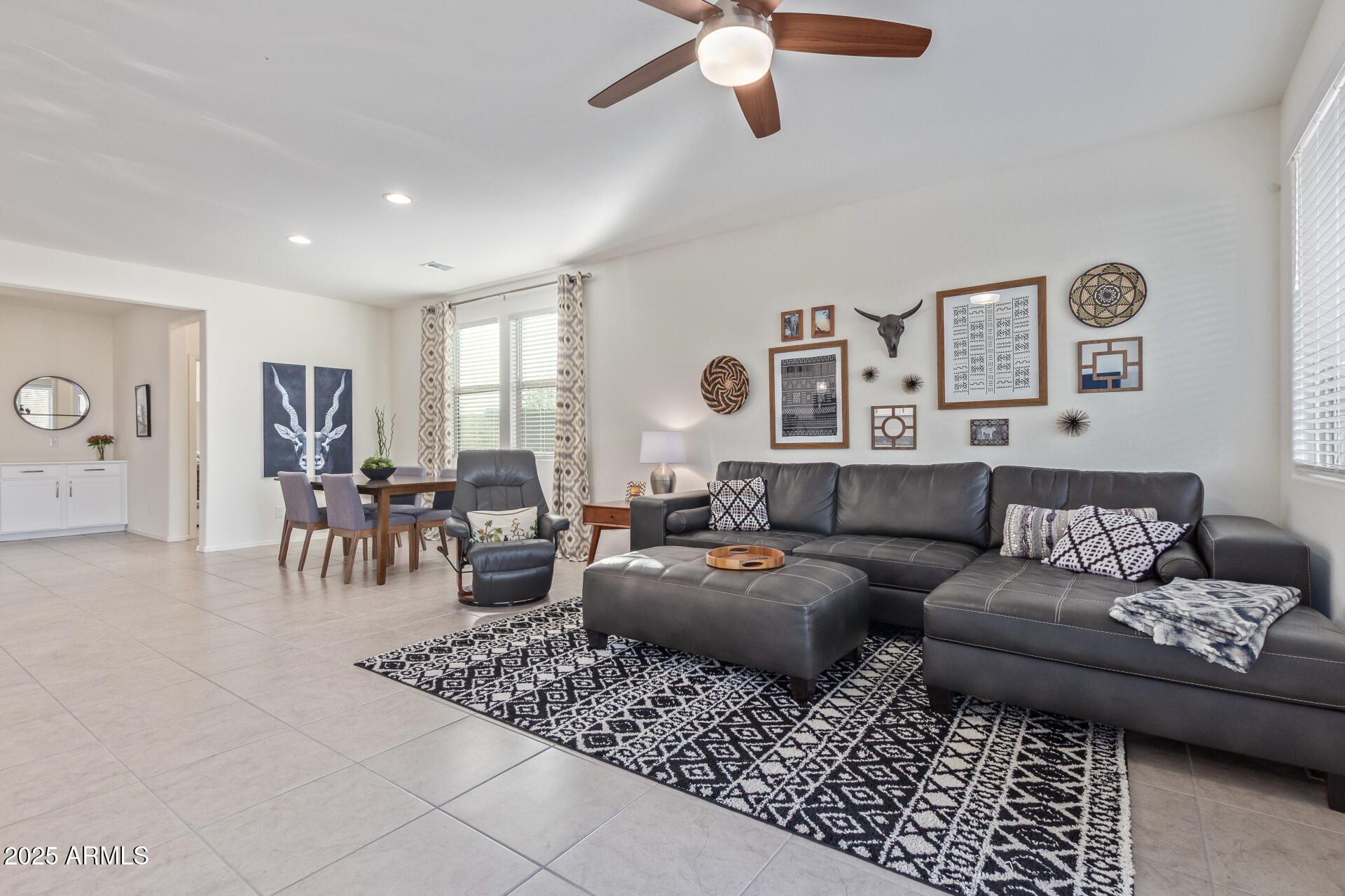 17796 West Sandy Road Goodyear, AZ 85338 - Photo 14 of 68 a living room with furniture and wooden floor