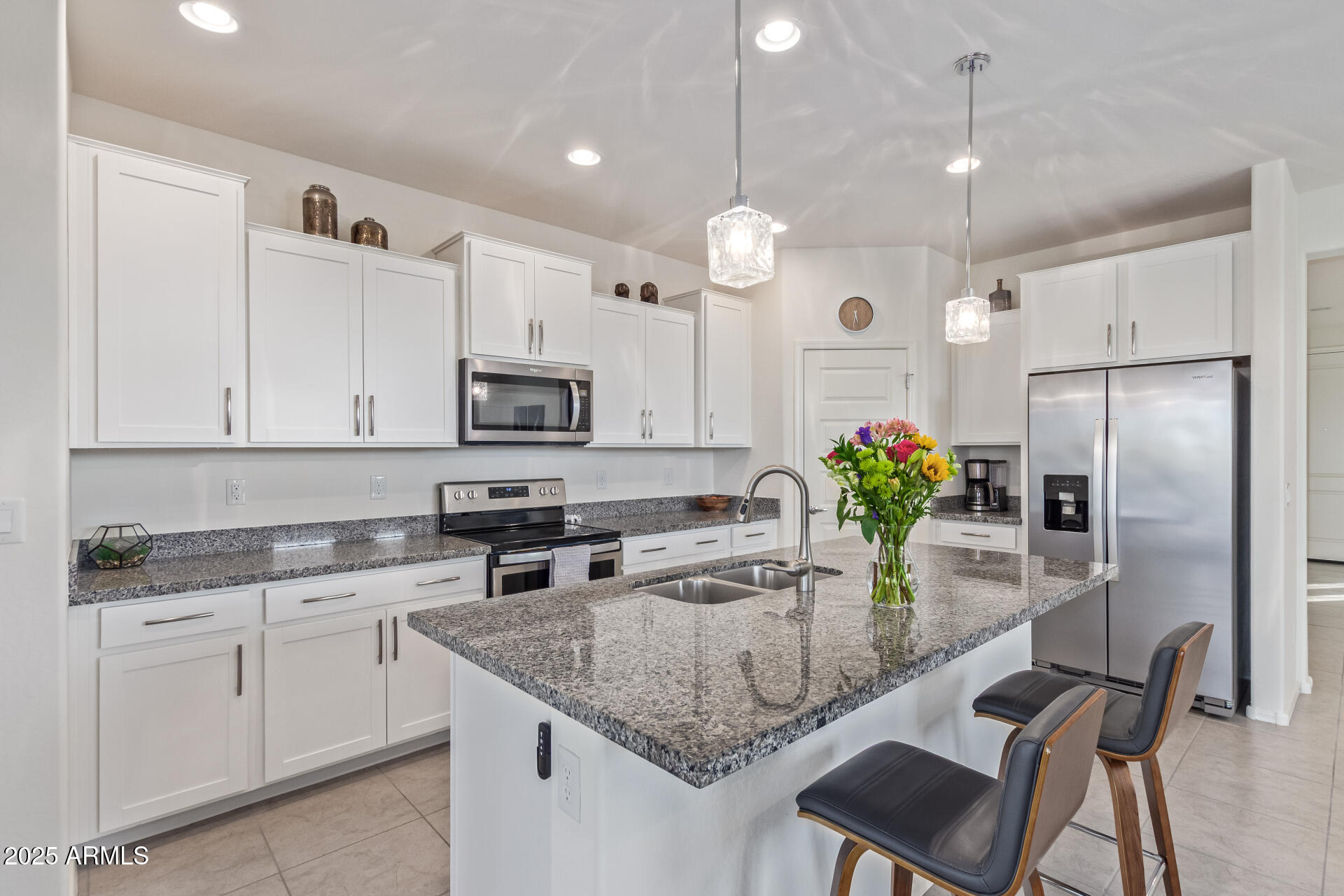 17796 West Sandy Road Goodyear, AZ 85338 - Photo 16 of 68 a kitchen with cabinets and stainless steel appliances