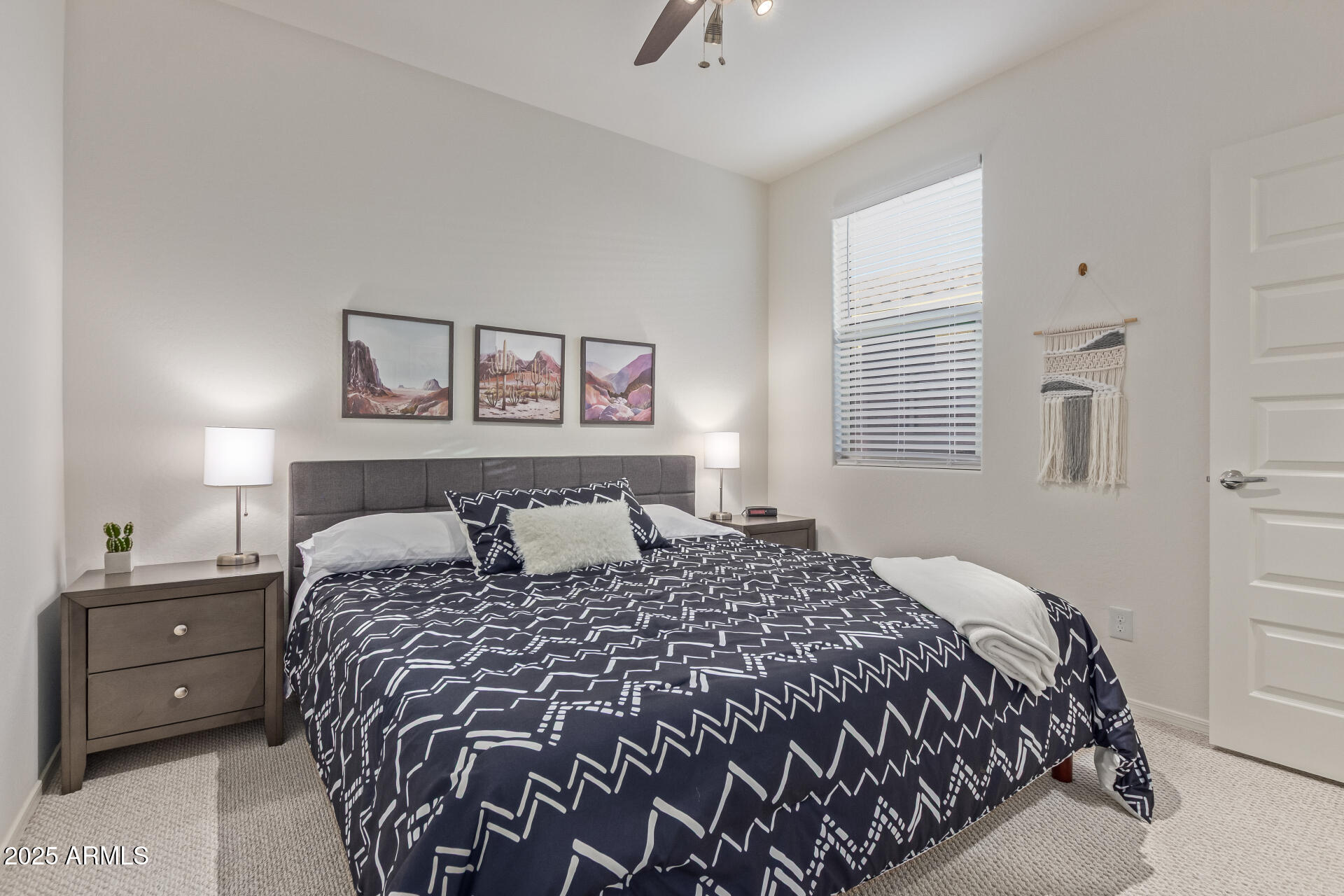 17796 West Sandy Road Goodyear, AZ 85338 - Photo 27 of 68 a bedroom with a large bed and a window
