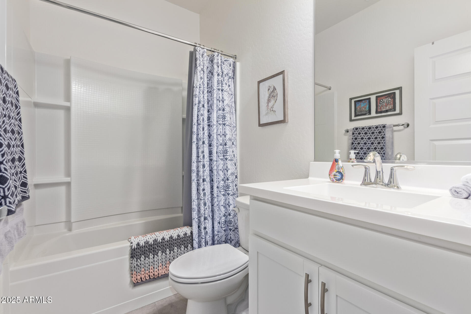 17796 West Sandy Road Goodyear, AZ 85338 - Photo 29 of 68 a bathroom with a sink toilet and shower