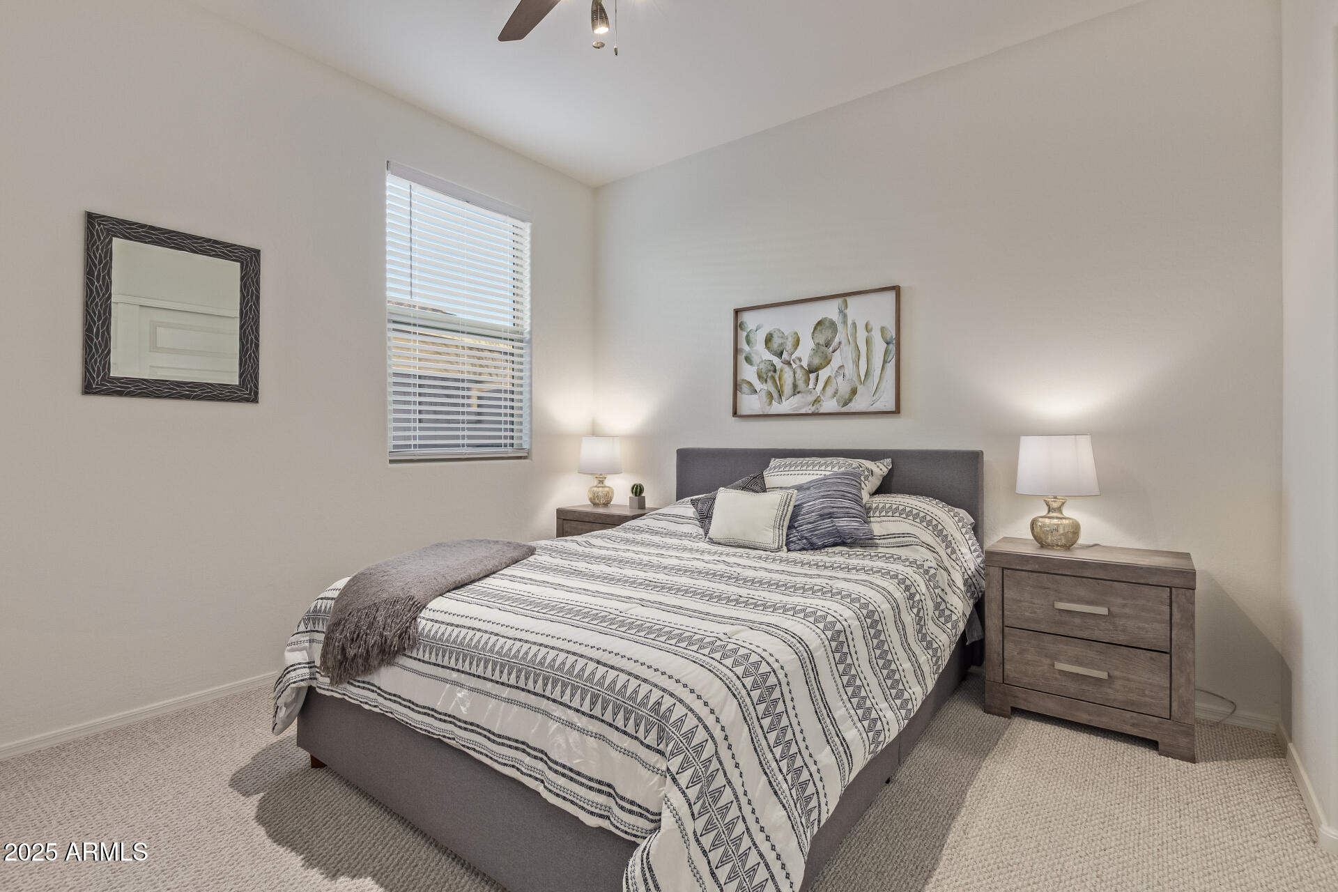 17796 West Sandy Road Goodyear, AZ 85338 - Photo 30 of 68 a bedroom with a bed and a wall painting