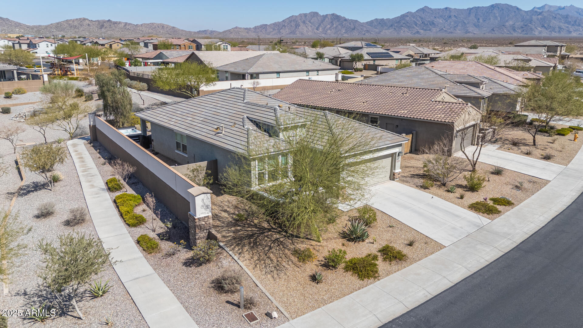 17796 West Sandy Road Goodyear, AZ 85338 - Photo 3 of 68 an aerial view of a house with a mountain