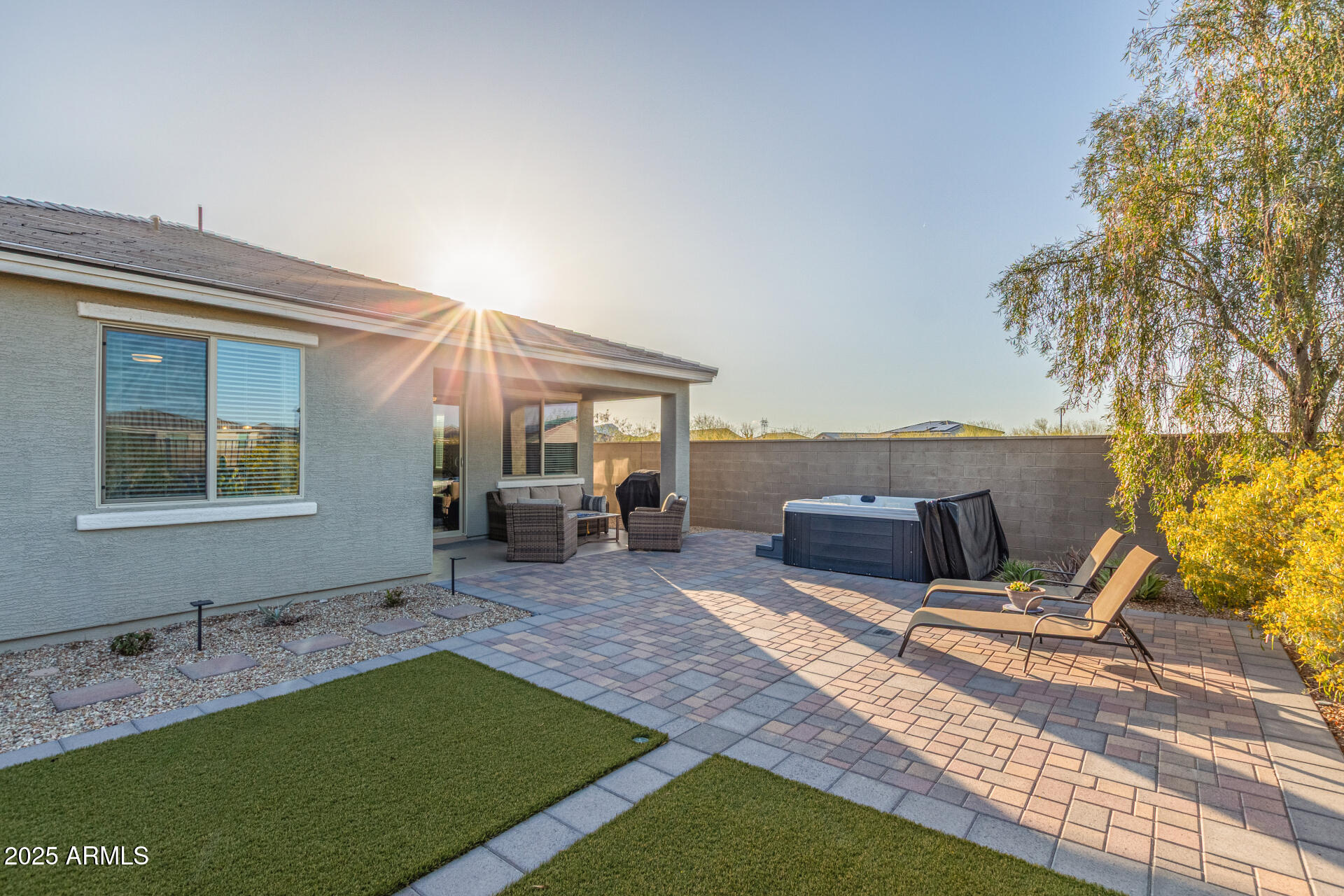 17796 West Sandy Road Goodyear, AZ 85338 - Photo 36 of 68 a backyard of a house with table and chairs