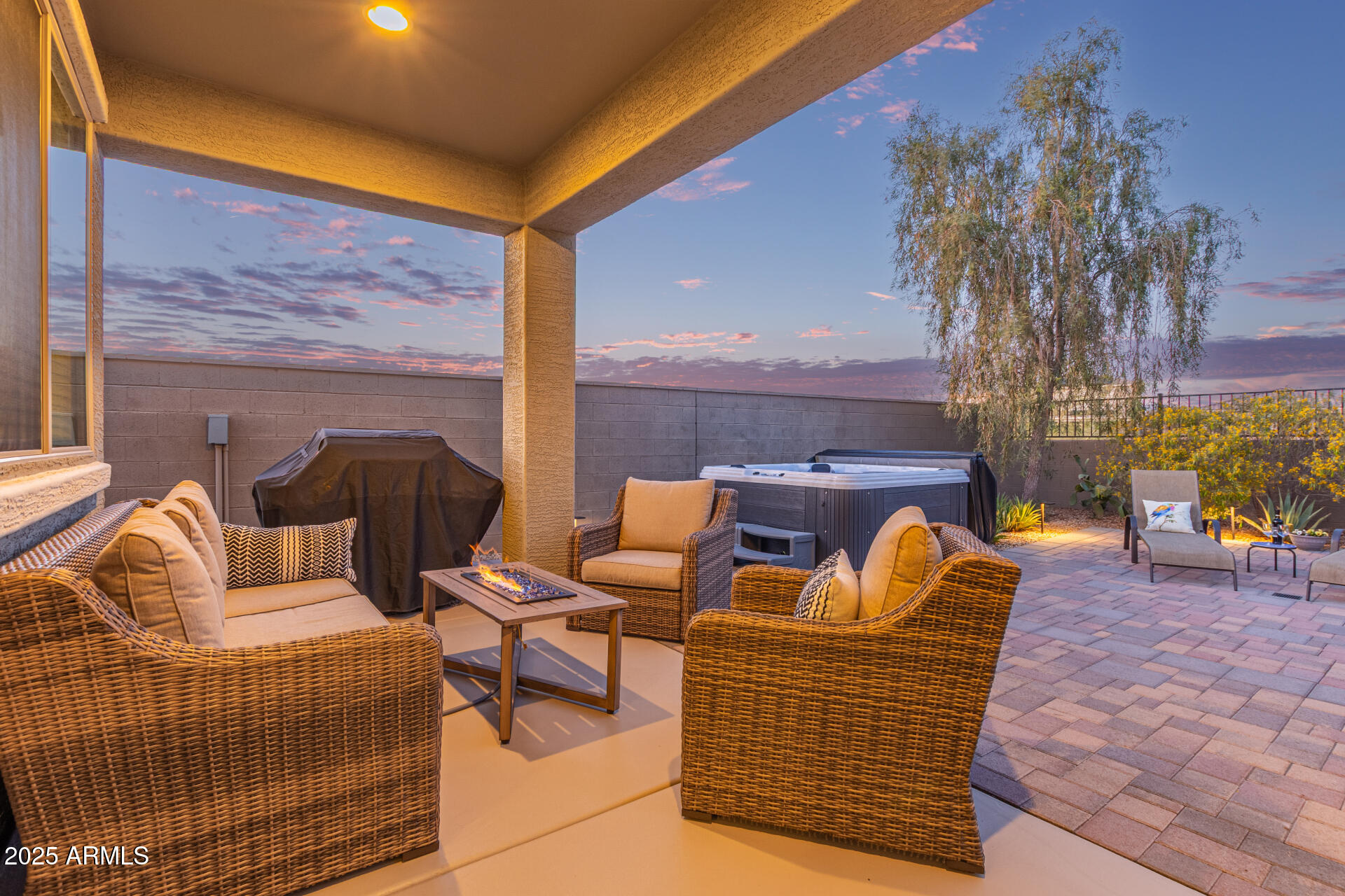 17796 West Sandy Road Goodyear, AZ 85338 - Photo 39 of 68 a outdoor living space with patio furniture and a fireplace