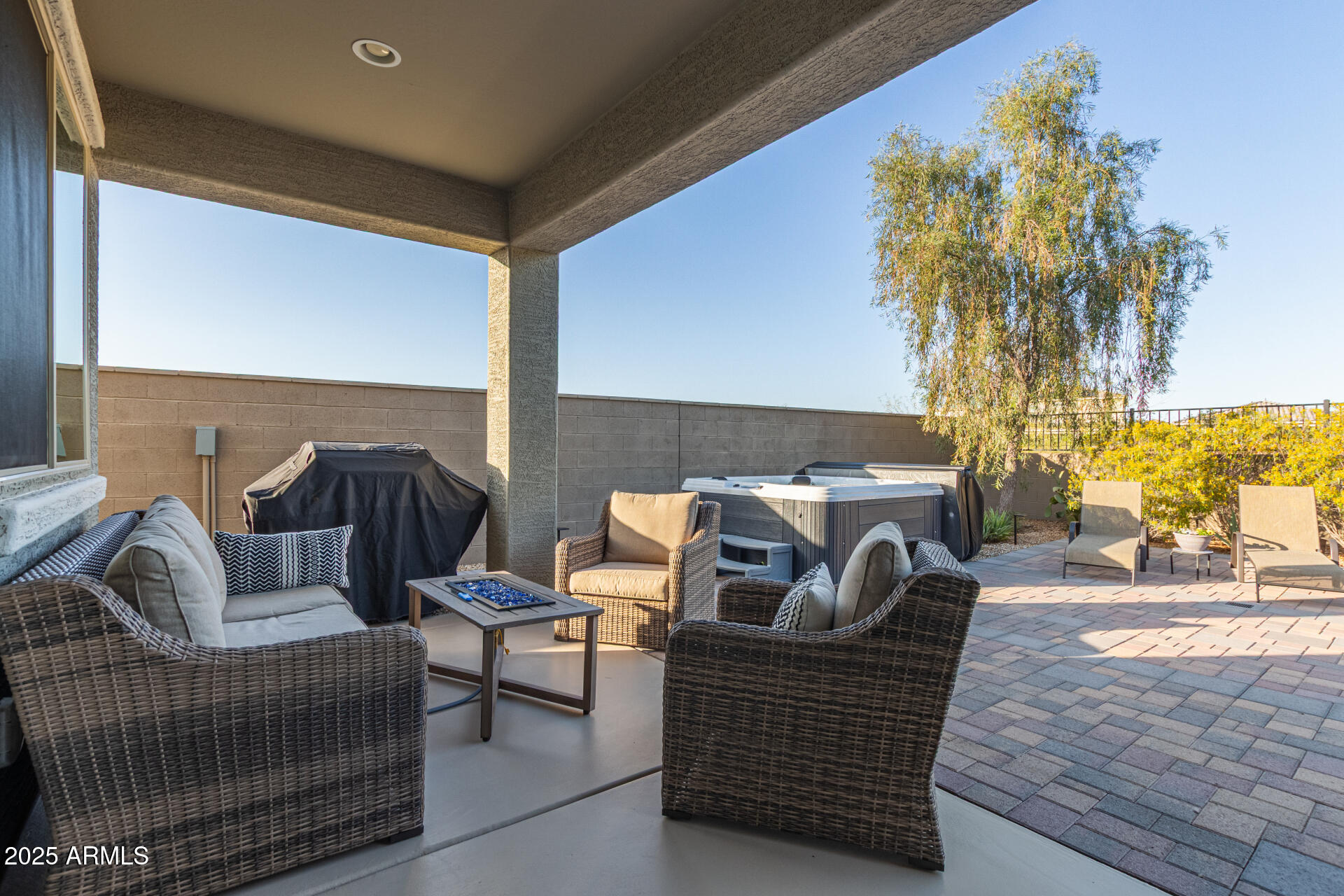 17796 West Sandy Road Goodyear, AZ 85338 - Photo 40 of 68 a balcony with furniture and a potted plant