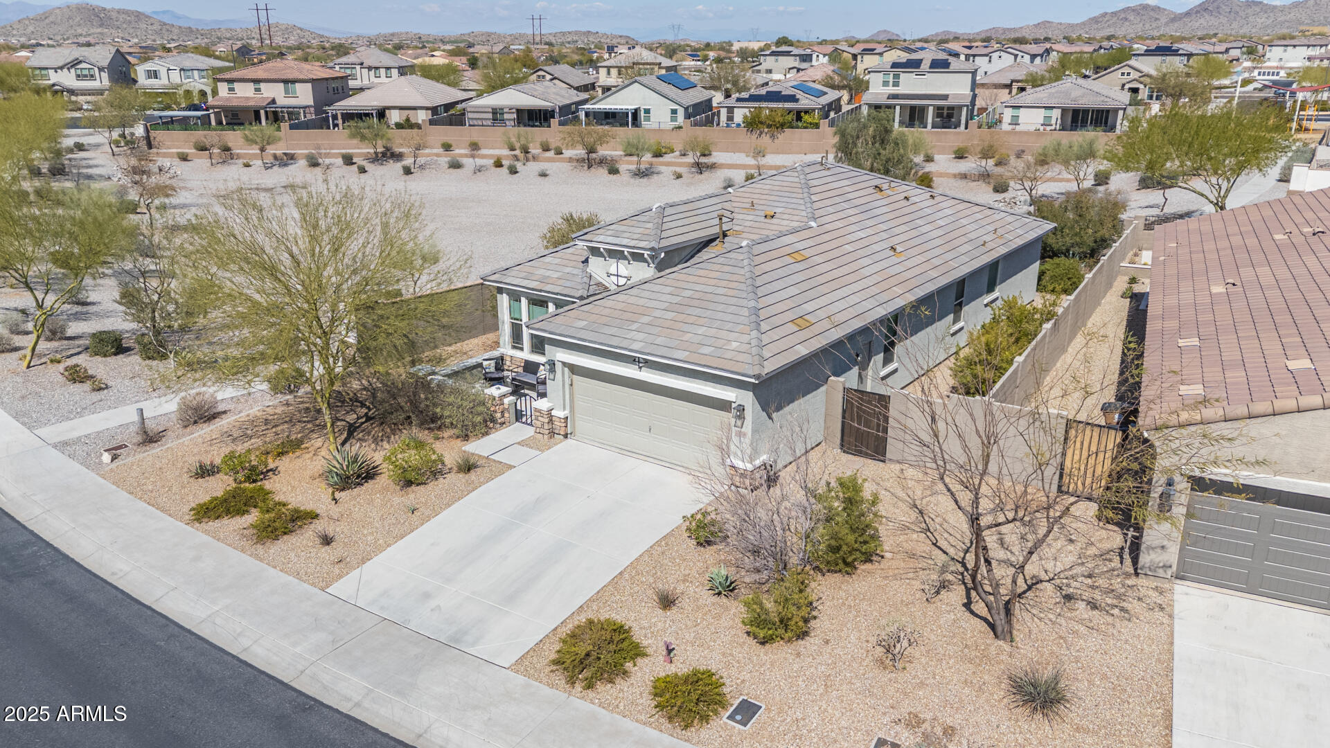 17796 West Sandy Road Goodyear, AZ 85338 - Photo 4 of 68 an aerial view of a house with a yard
