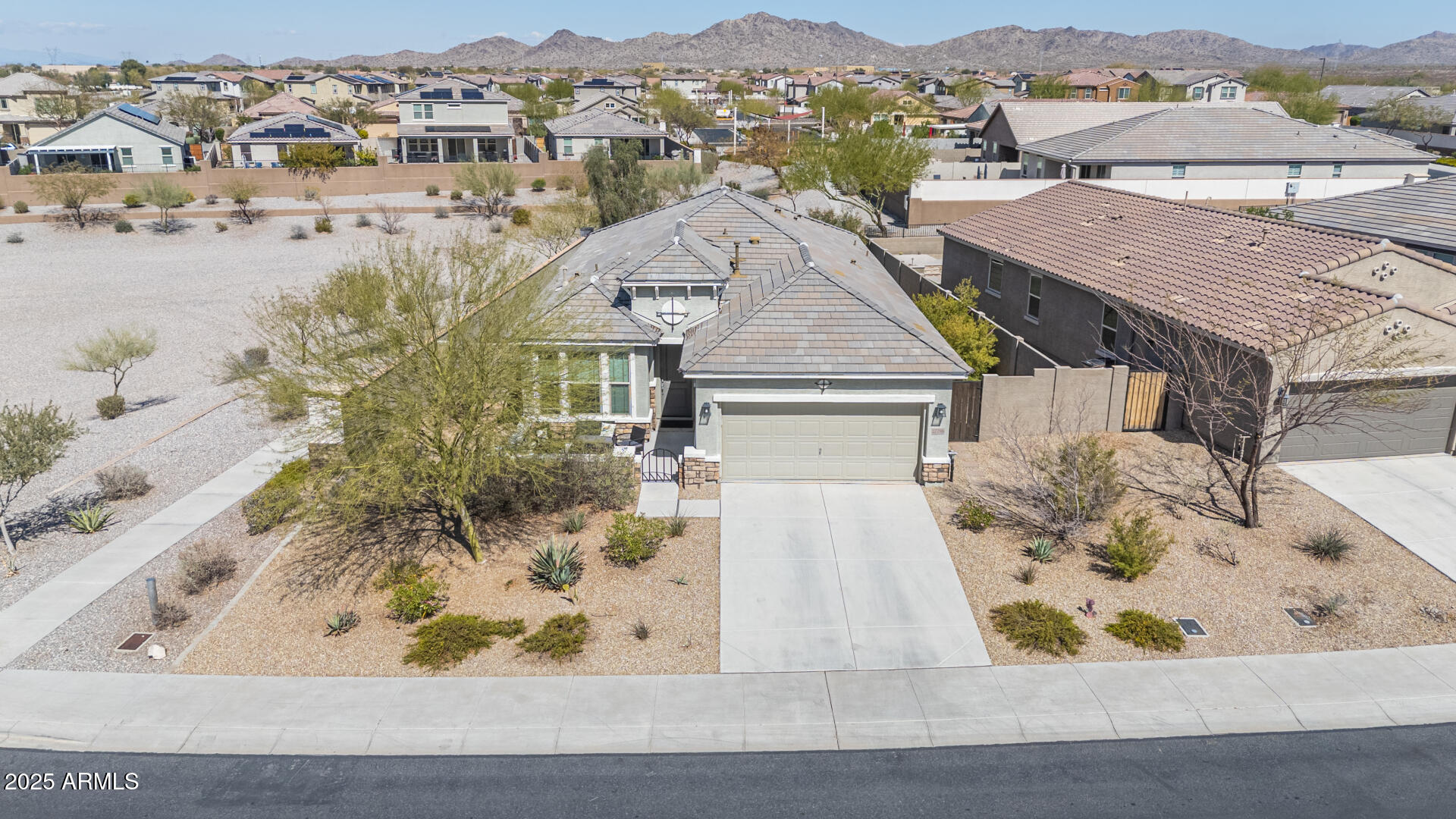 17796 West Sandy Road Goodyear, AZ 85338 - Photo 47 of 68 an aerial view of a house with a mountain