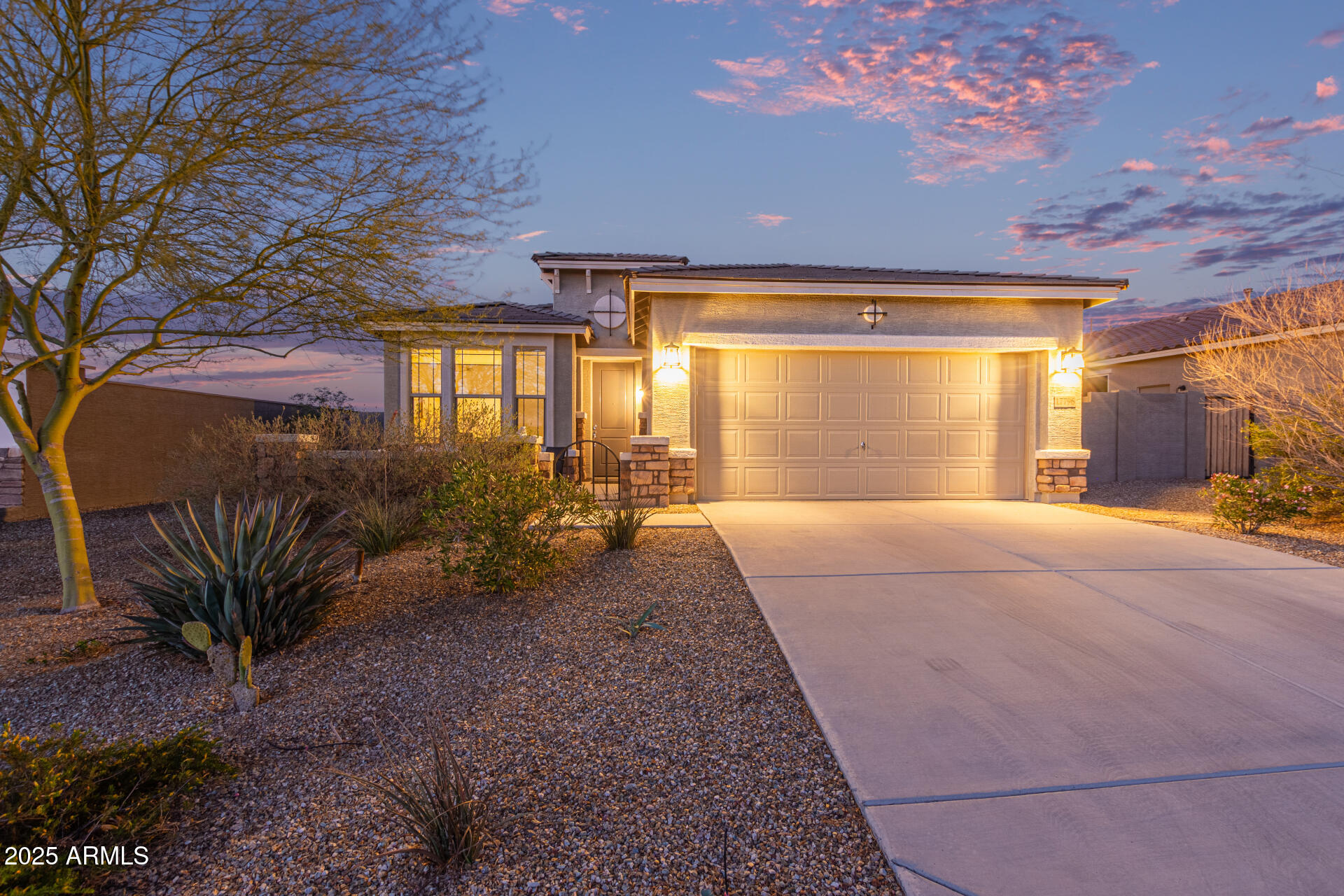 17796 West Sandy Road Goodyear, AZ 85338 - Photo 53 of 68 a front view of a house with garden