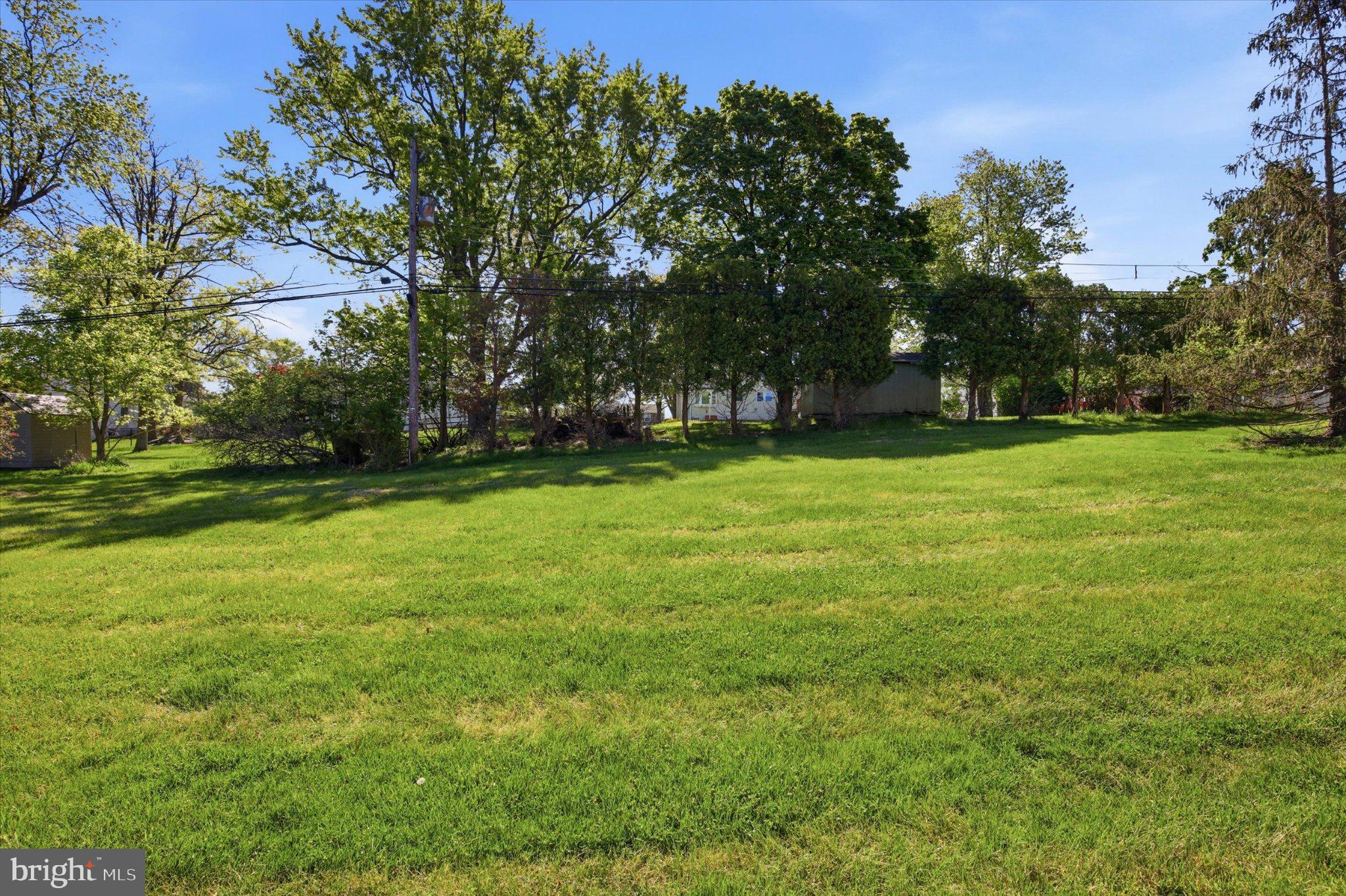 120 Harry Road Eagleville, PA 19403 - Photo 6 of 7 Lush green expanse under clear skies.