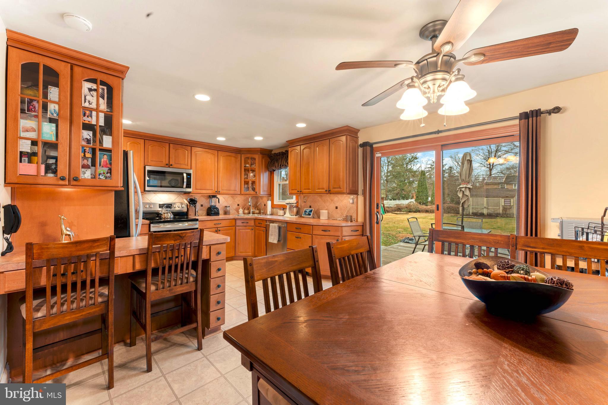 992 Jamison Street Warminster, PA 18974 - Photo 13 of 37 a view of a dining room with furniture a chandelier and wooden floor