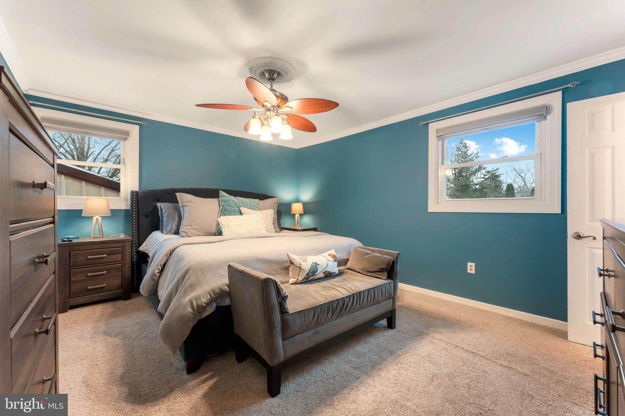 992 Jamison Street Warminster, PA 18974 - Photo 24 of 37 a bedroom with a large bed and a chandelier