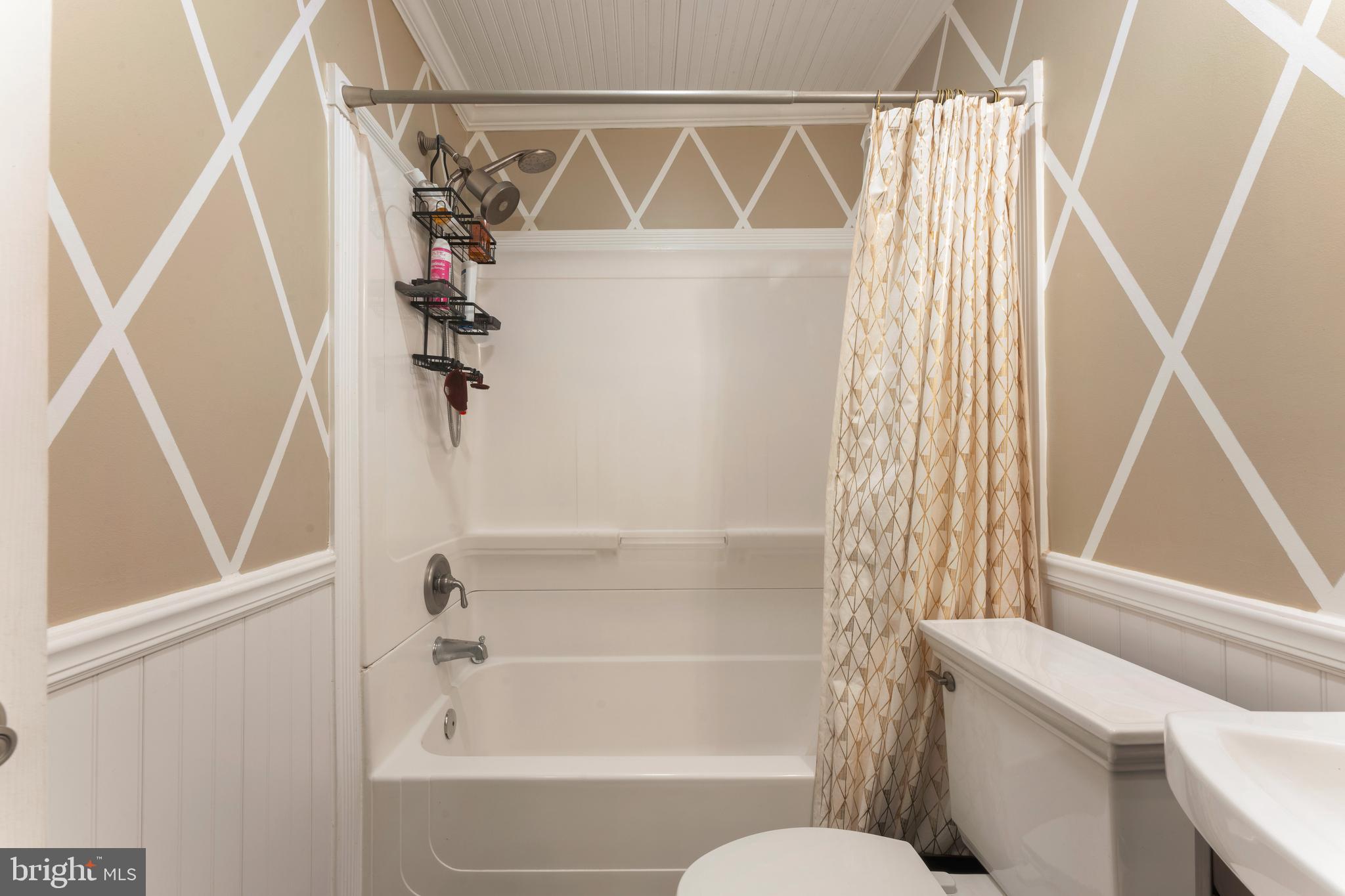 992 Jamison Street Warminster, PA 18974 - Photo 27 of 37 a bathroom with a shower a toilet and a window