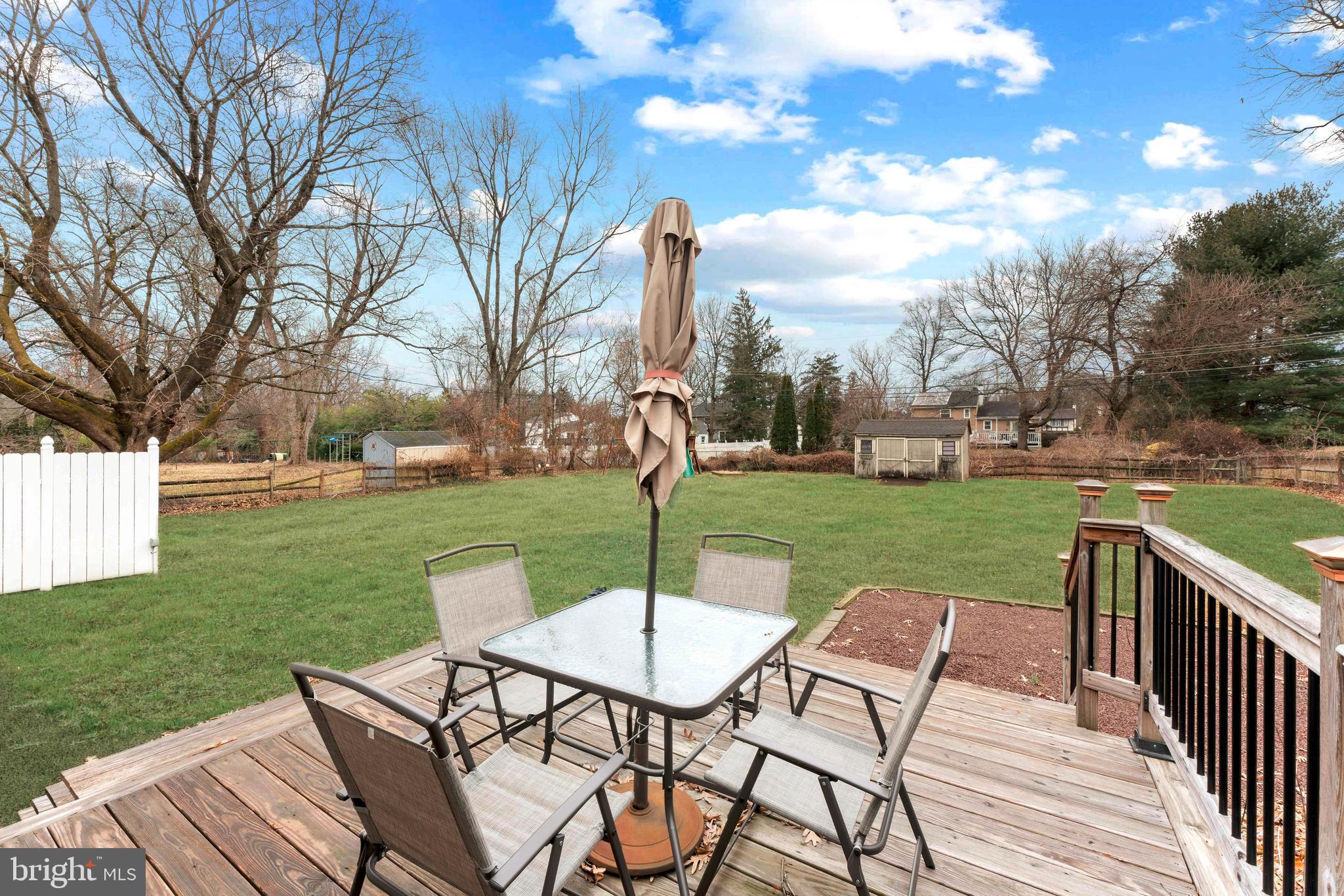 992 Jamison Street Warminster, PA 18974 - Photo 37 of 37 a view of a patio with a table chairs and a yard